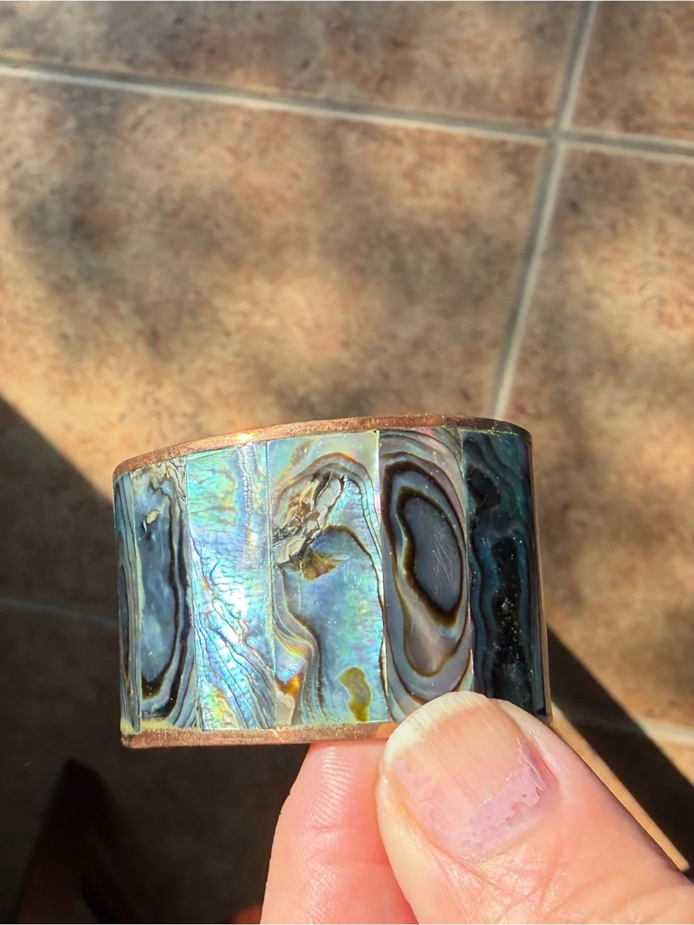 Copper and abalone shell napkin rings